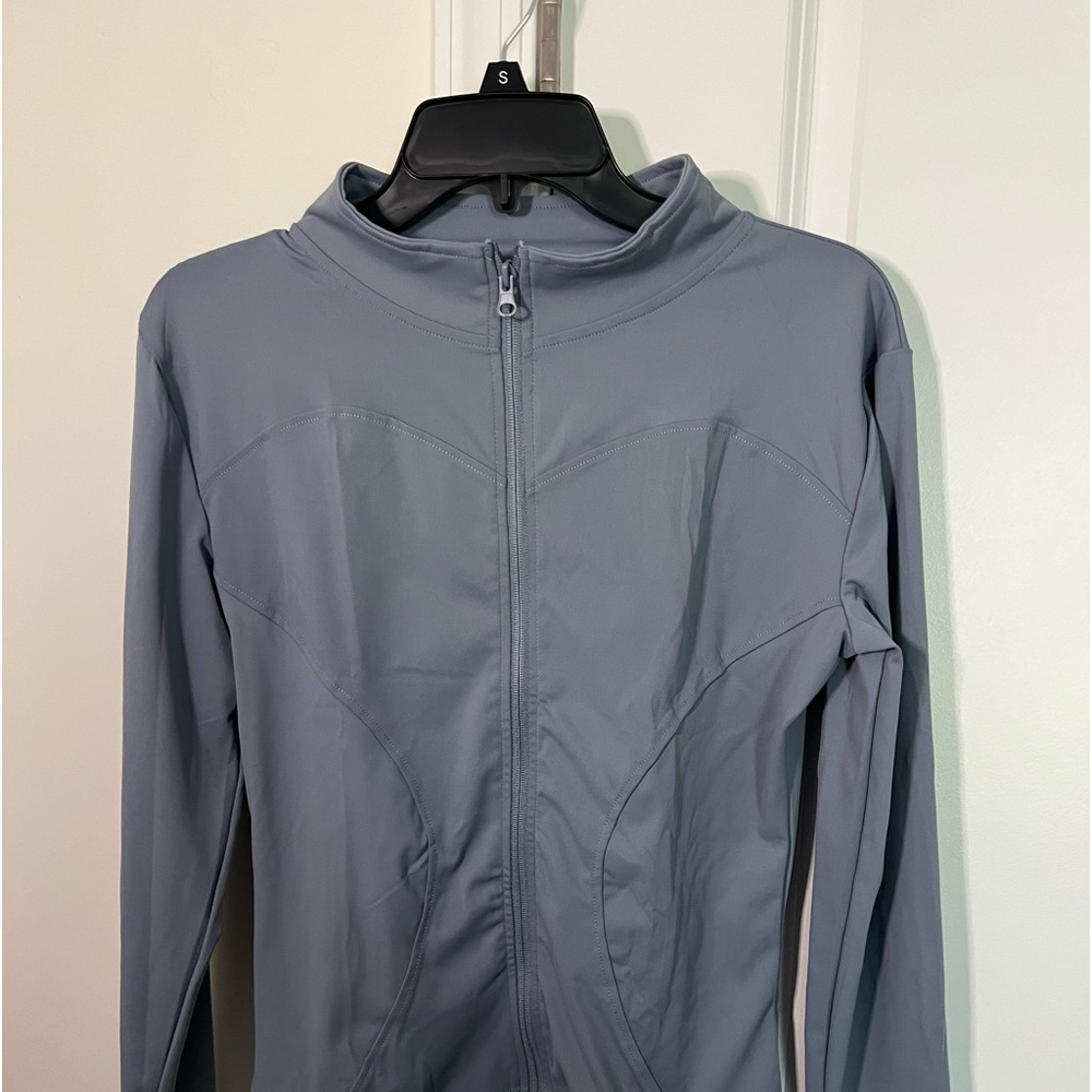 Athletic wear women’s zip up jacket.